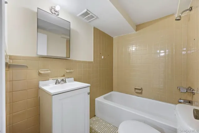 a view of an empty room and closet area