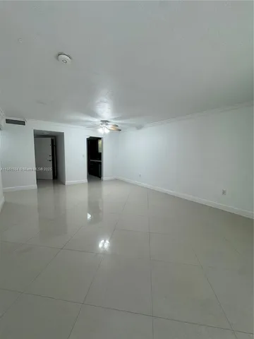 a view of empty room with a fireplace