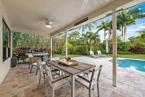 an aerial view of residential houses with outdoor space and street view