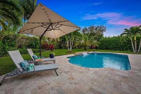 a view of a swimming pool with a patio