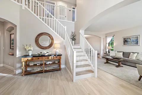 a kitchen with kitchen island a stove and a refrigerator
