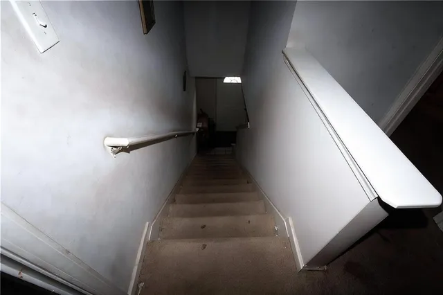 a view of an entryway with wooden floor
