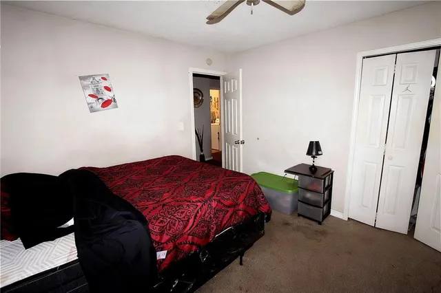 a bathroom with a sink a light fixture and a mirror