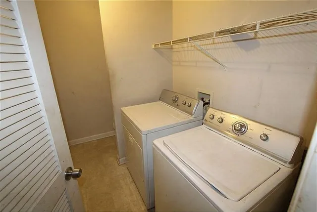 a bedroom with a bed and a large mirror