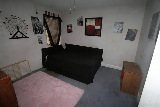 a bedroom with a bed and cabinets