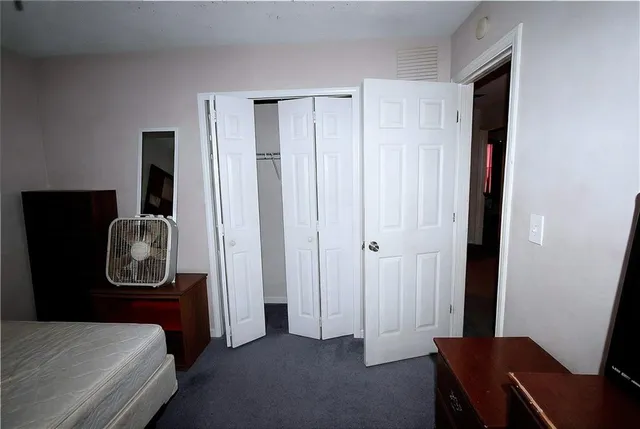 a bed room with furniture and a bed