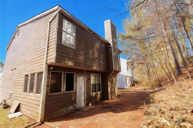 a view of a house with a street