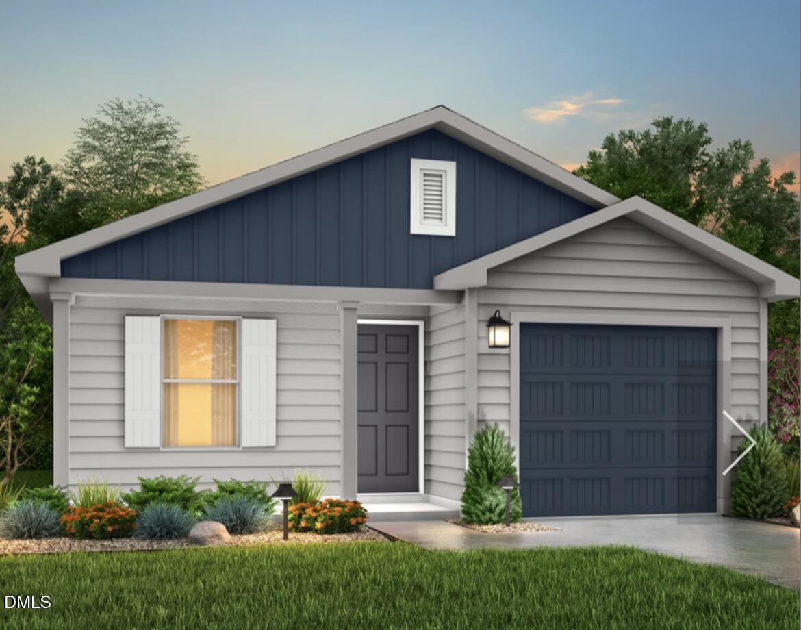 105 Lillian Court Roxboro, NC 27573 - Photo 1 of 7 a front view of a house with a garden