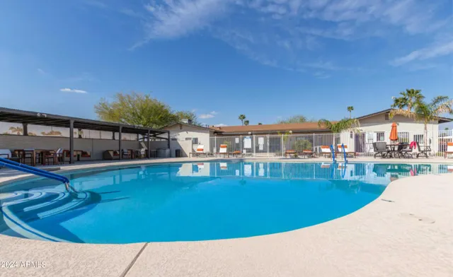 a view of a swimming pool with a patio