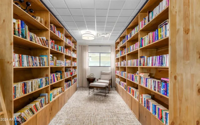 a room with bookshelf lots of books and a book shelf