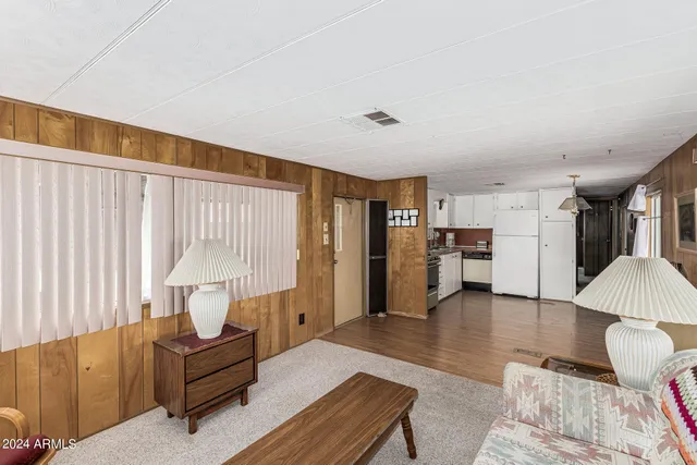 a living room with furniture and a table