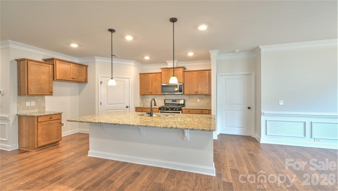 649 River Btm Road Fletcher, NC 28732 - Photo 10 of 40 a large kitchen with granite countertop a large counter top a sink stainless steel appliances and cabinets
