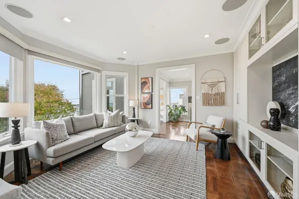 a bathroom with a granite countertop sink and a large mirror