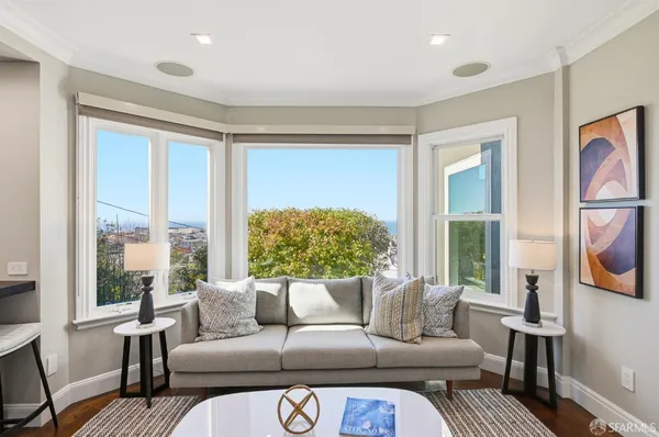 a view of a dining room with furniture window and outside view