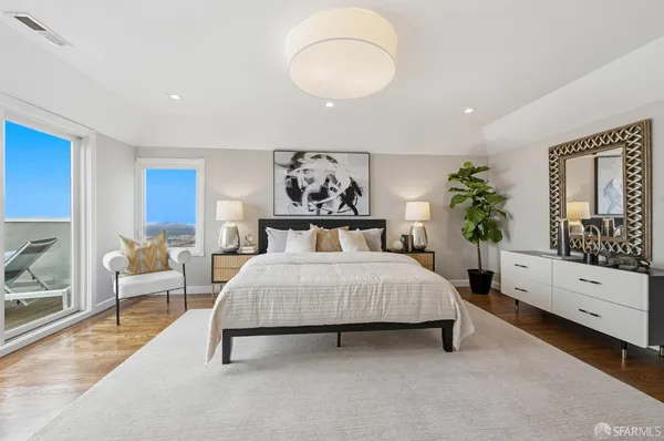 a bedroom with bed and a window