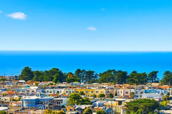 a bedroom with furniture and a wooden floor