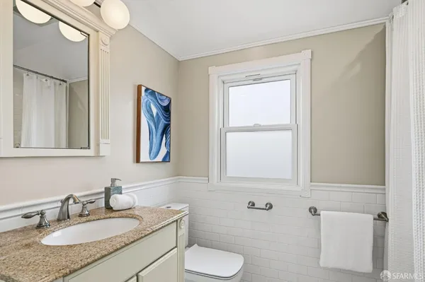 a view of a patio with couches table and chairs and potted plants