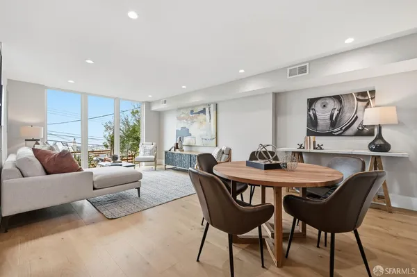 an aerial view of a house with a yard and lake view