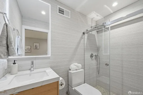 an aerial view of residential houses with city view