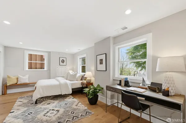 a front view of a building with potted plants