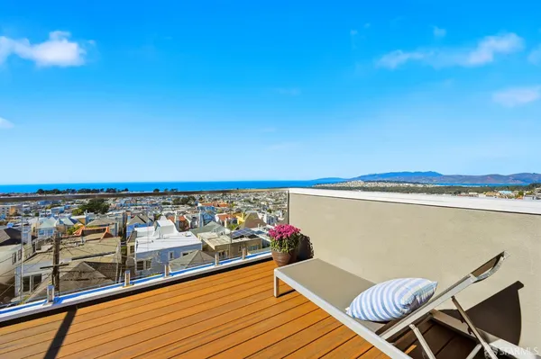 a view of a balcony with chairs