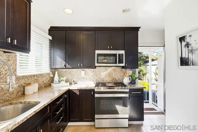 a view of a kitchen with washer and dryer