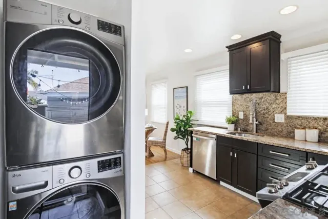 a bedroom with a bed and a potted plant