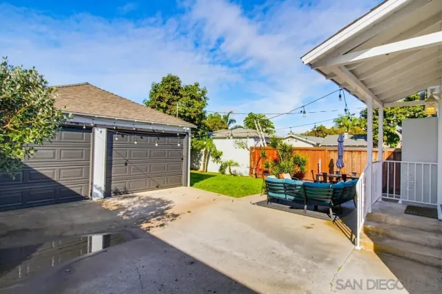a front view of a house with a yard and a garage