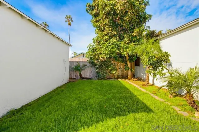a view of a city street with tall buildings