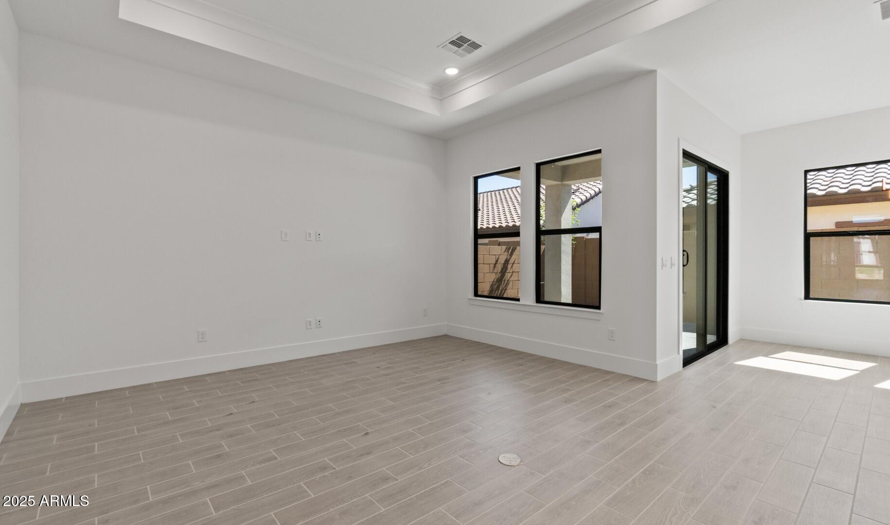 20307 West Roma Avenue Buckeye, AZ 85396 - Photo 11 of 48 an empty room with windows and closet