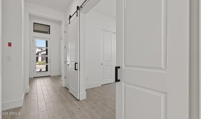 an empty room with windows and closet