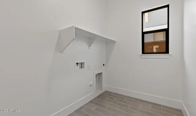 a view of an entryway with wooden floor