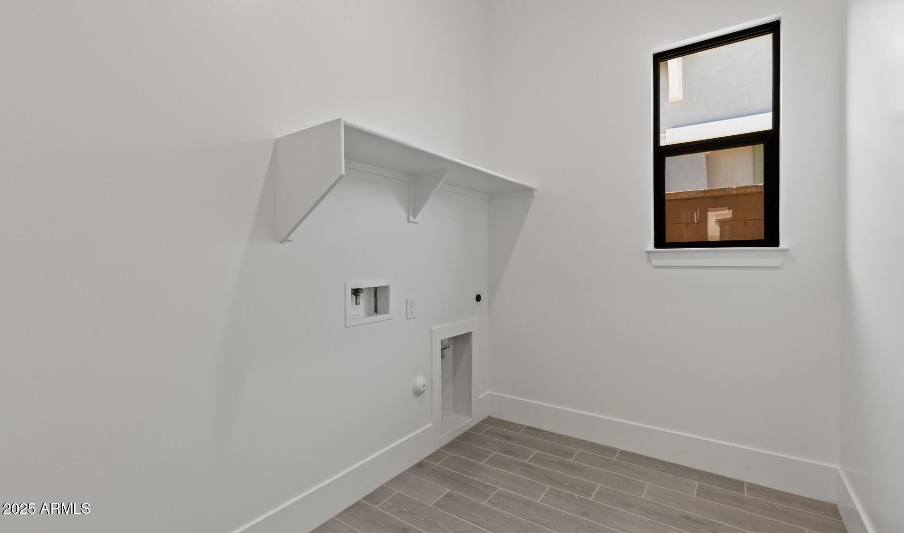 20307 West Roma Avenue Buckeye, AZ 85396 - Photo 23 of 48 a view of an entryway with wooden floor