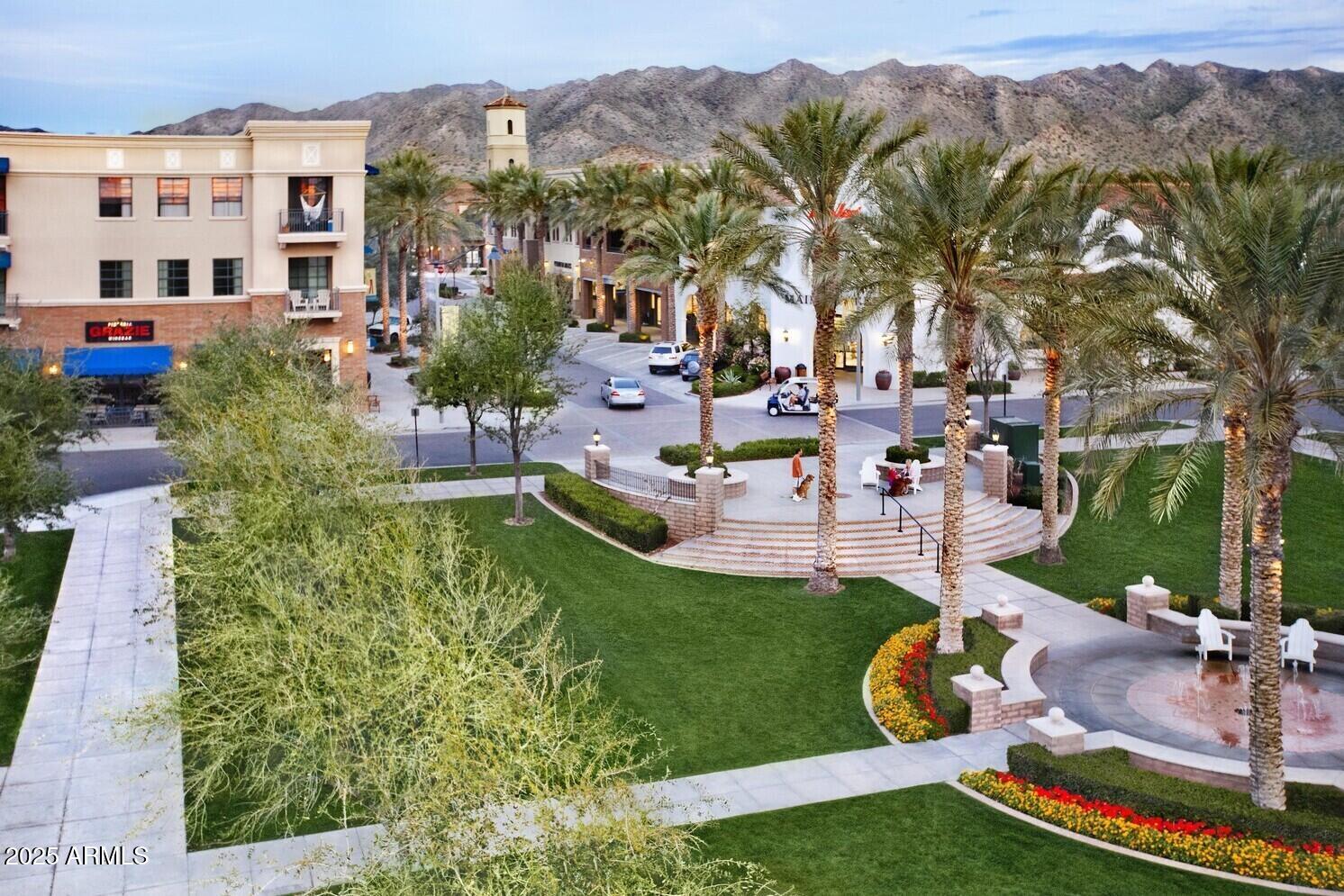 20307 West Roma Avenue Buckeye, AZ 85396 - Photo 29 of 48 a view of a swimming pool with a garden and plants