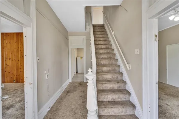 a view of a hallway with staircase