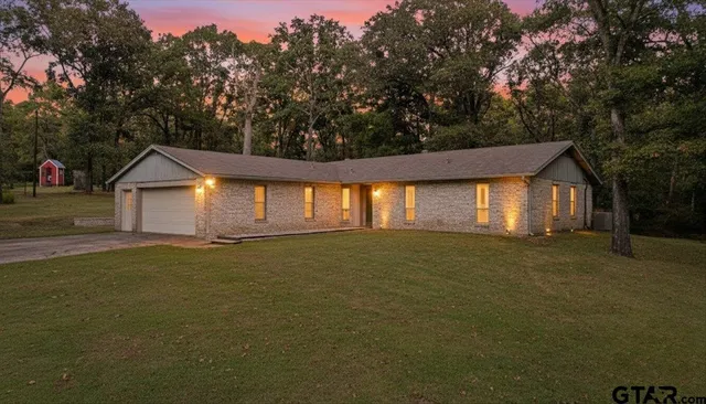 a house with trees in front of it