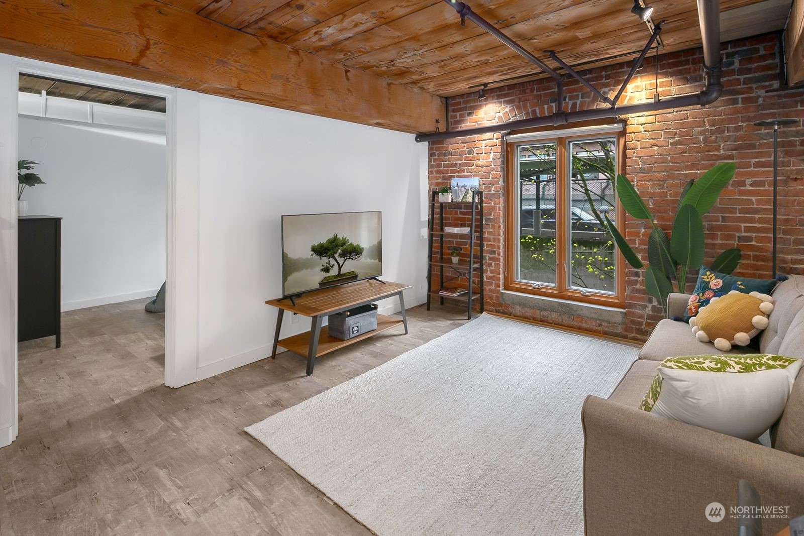 1507 Western Avenue, Unit R503 Seattle, WA 98101 - Photo 8 of 15 a living room with furniture and a floor to ceiling window