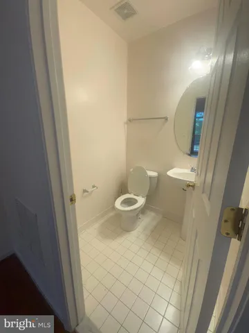 a bathroom with a toilet and a sink