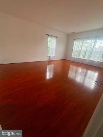 wooden view of empty room with window