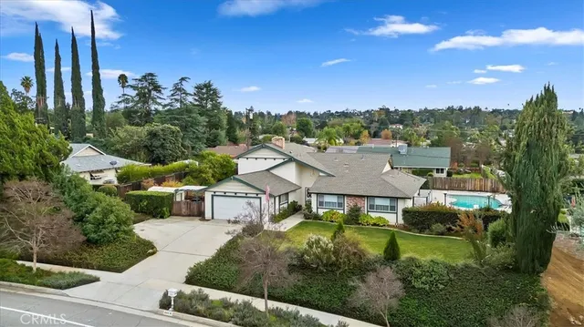 an aerial view of a house with a garden