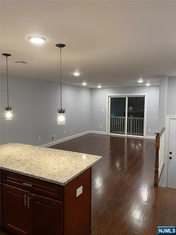 a view of a kitchen with a sink and microwave