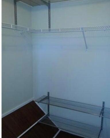 5267 Pine Meadows Road Lake Worth, FL 33463 - Photo 12 of 17 a view of a room with rack on the wall