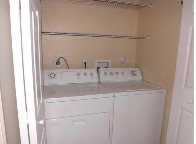 5267 Pine Meadows Road Lake Worth, FL 33463 - Photo 13 of 17 a utility room with dryer and washer