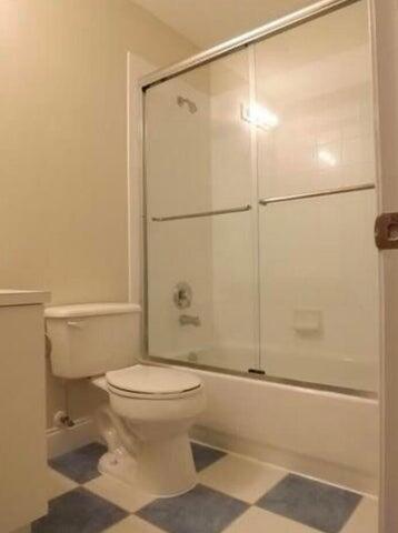 5267 Pine Meadows Road Lake Worth, FL 33463 - Photo 14 of 17 a bathroom with a toilet and a shower