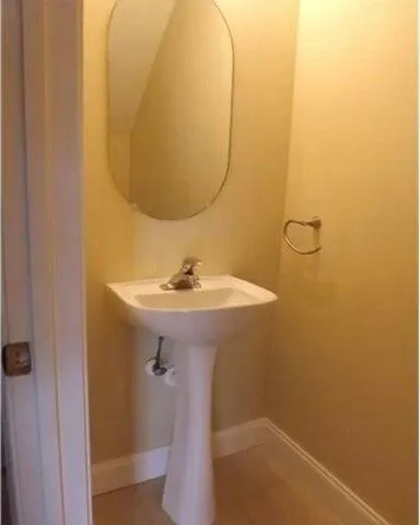 a bathroom with a sink and mirror