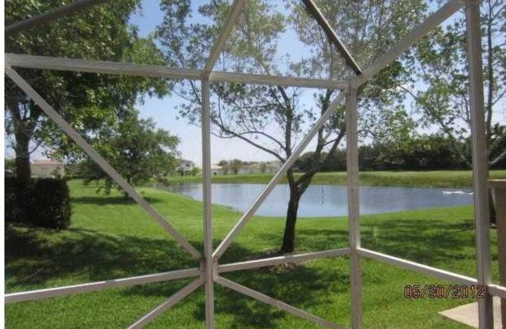 5267 Pine Meadows Road Lake Worth, FL 33463 - Photo 7 of 17 a view of backyard with green space