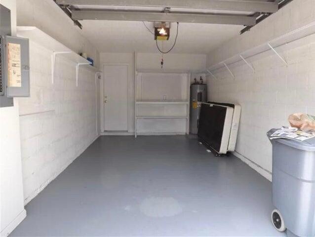 5267 Pine Meadows Road Lake Worth, FL 33463 - Photo 9 of 17 a view of storage and utility room with closet