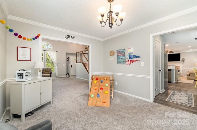 a view of a bedroom with furniture and toys