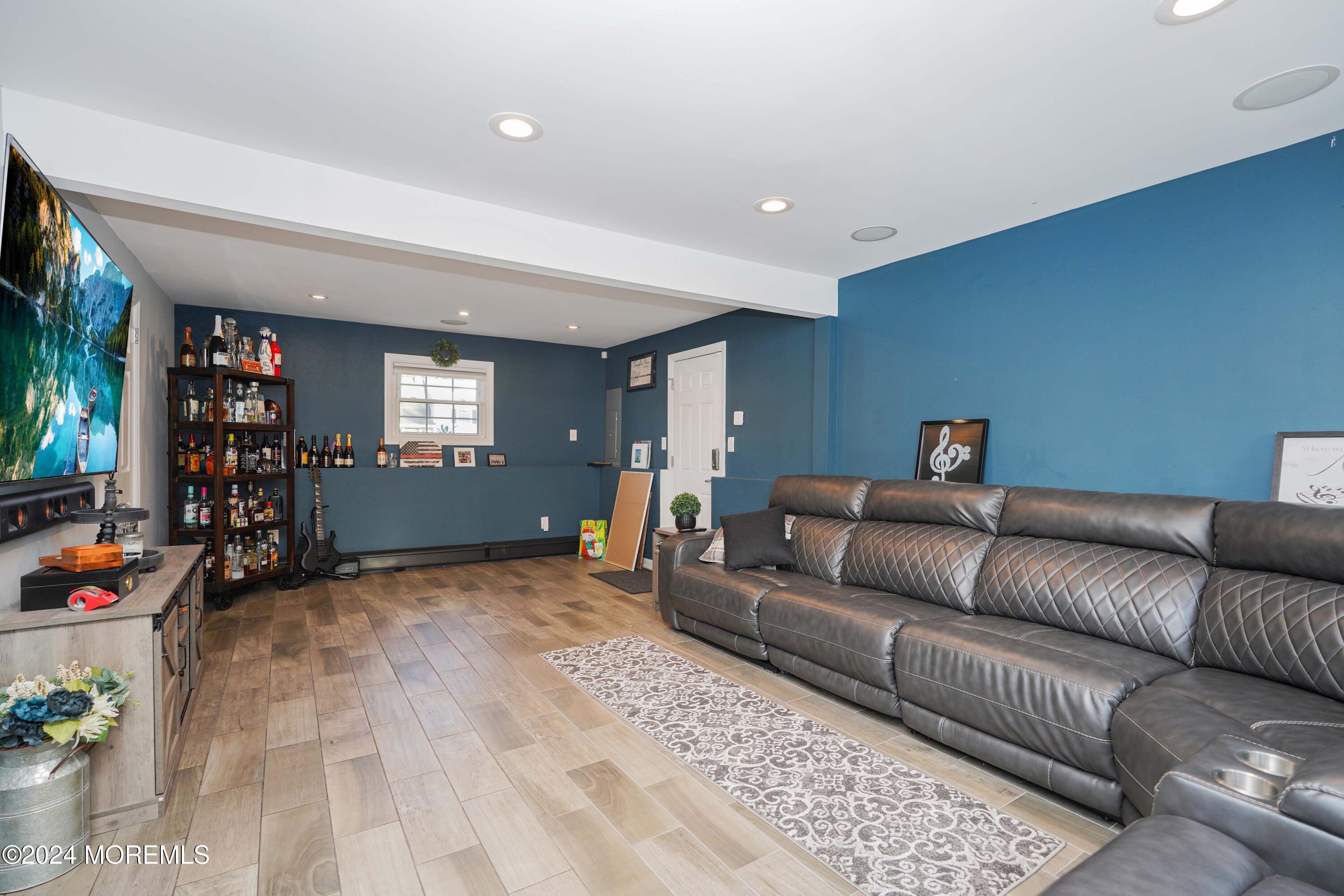 13 Bartle Road Somerset, NJ 08873 - Photo 14 of 26 a living room with furniture and a flat screen tv