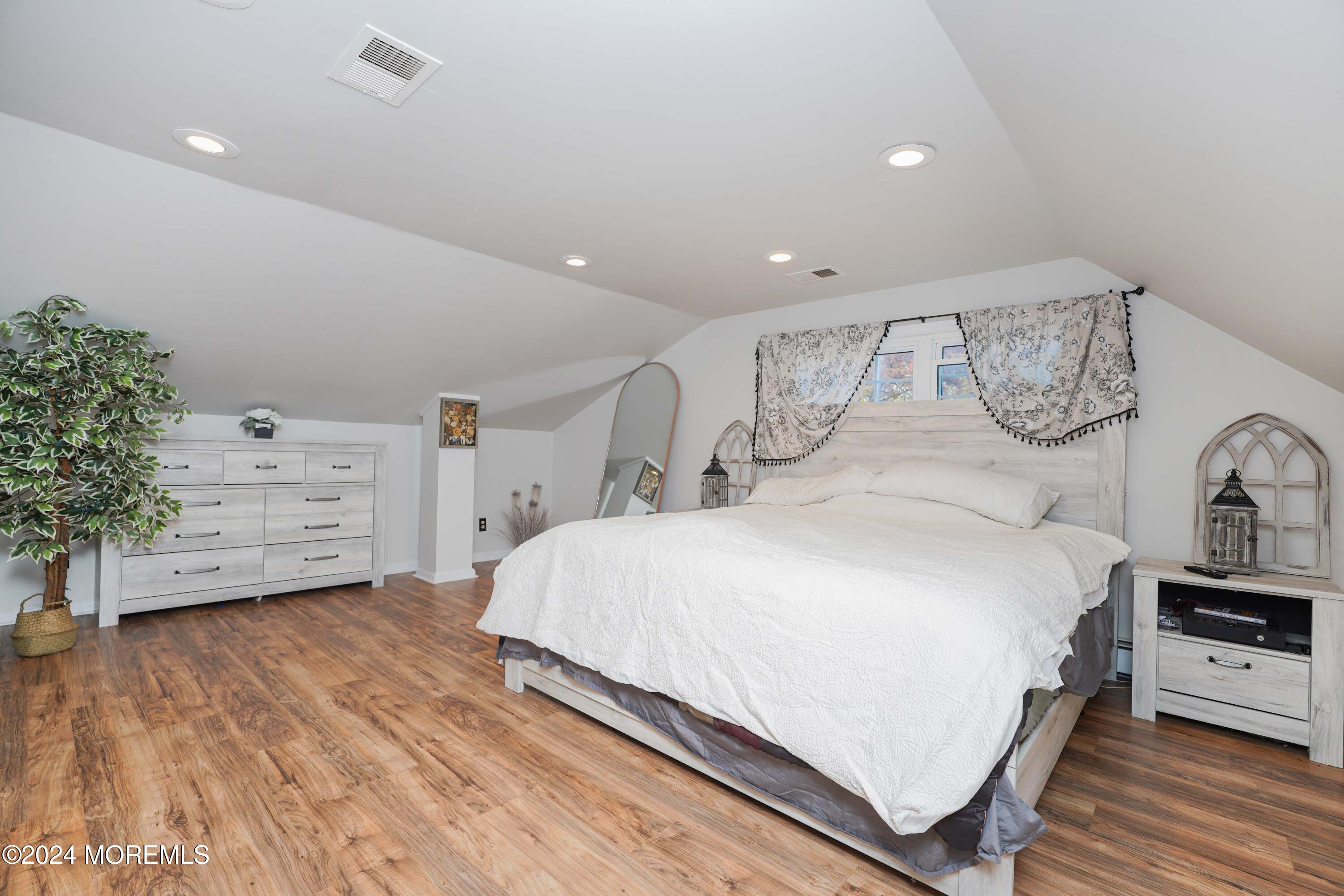 13 Bartle Road Somerset, NJ 08873 - Photo 15 of 26 a large bedroom with a bed and a dresser